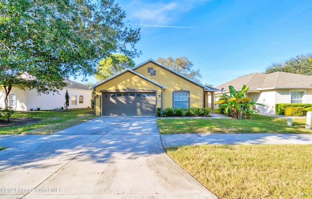 single story home with a garage and a front yard