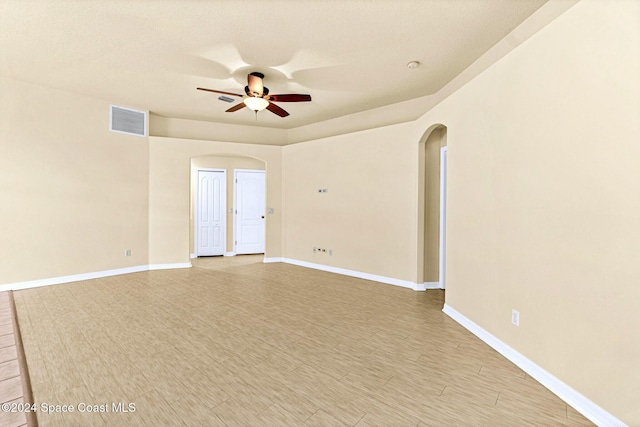 unfurnished room with ceiling fan