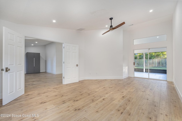 empty room featuring light wood-type flooring and ceiling fan