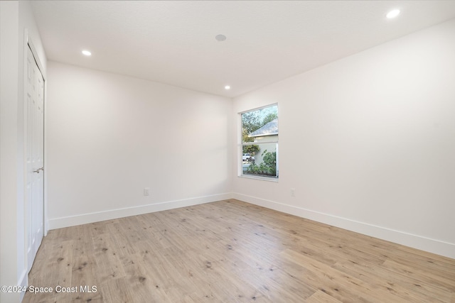 unfurnished room featuring light hardwood / wood-style flooring