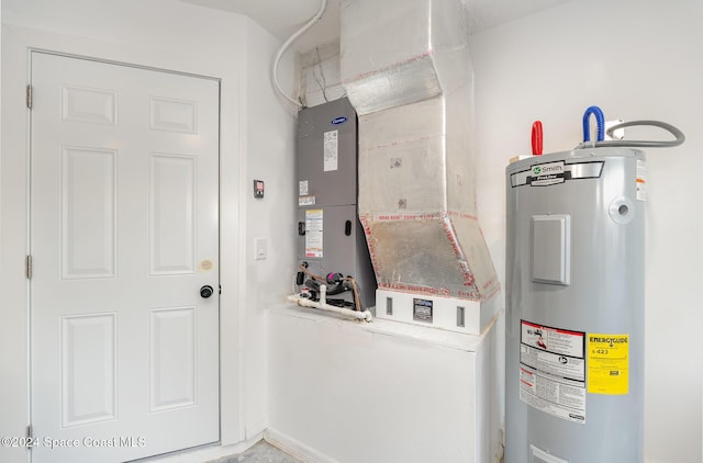 utility room featuring electric water heater