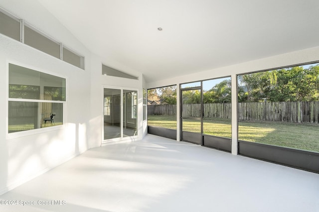 unfurnished sunroom with vaulted ceiling and a wealth of natural light