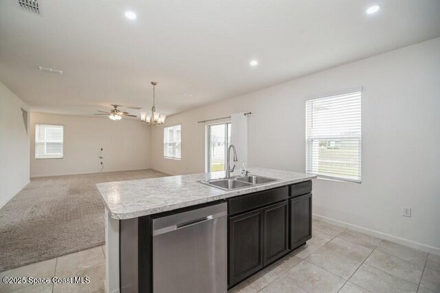 kitchen with light carpet, a center island with sink, dishwasher, hanging light fixtures, and sink