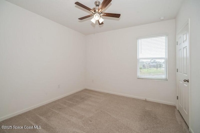 unfurnished room featuring ceiling fan and light colored carpet