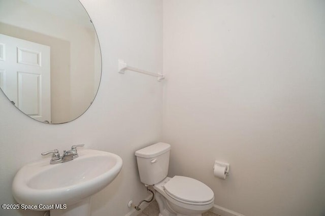 bathroom with toilet and sink