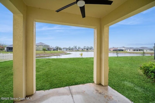 view of patio with a water view