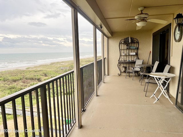3170 N Atlantic Ave Unit 502, Cocoa Beach, FL 32931 - balcony featuring view of water and beach and ceiling fan