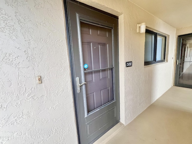 3170 N Atlantic Ave Unit 502, Cocoa Beach, FL 32931 - property entrance with stucco siding