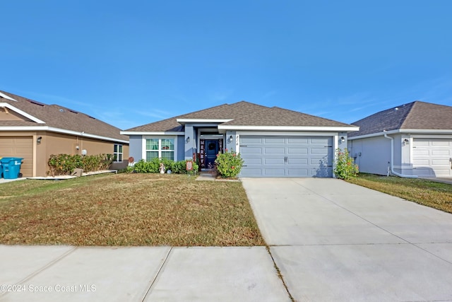 single story home with a front yard and a garage