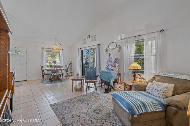 tiled living room with high vaulted ceiling