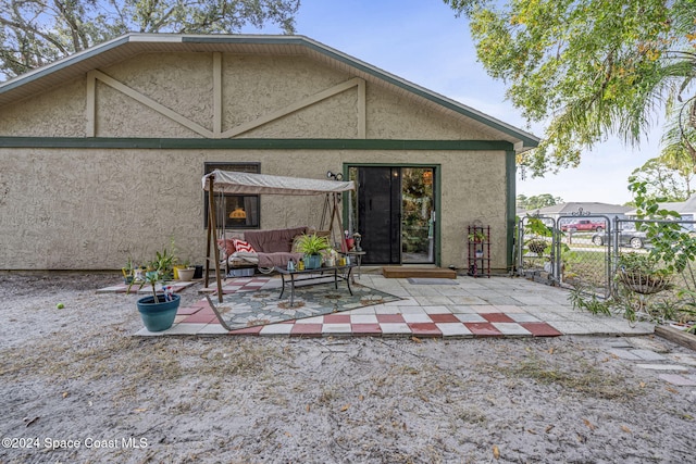 back of house featuring an outdoor hangout area and a patio area