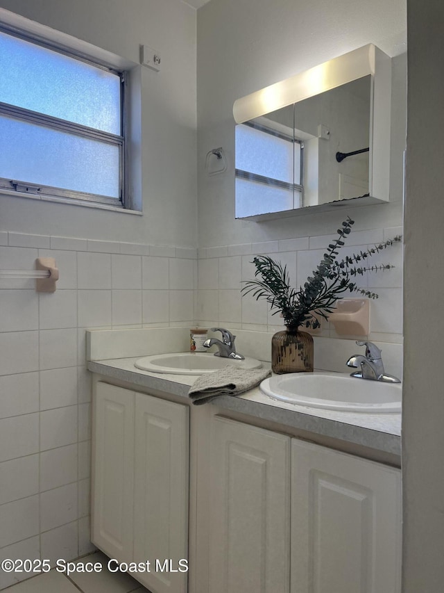 bathroom featuring decorative backsplash and vanity