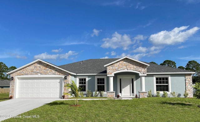 view of front facade featuring a garage and a front lawn