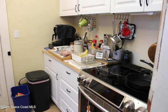 kitchen with white cabinets and high end range