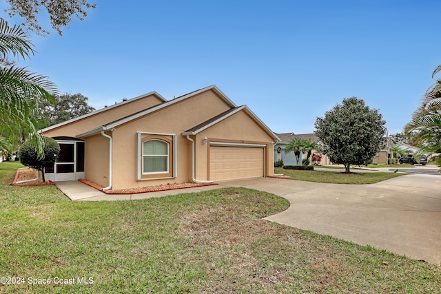 ranch-style house featuring a garage and a front yard