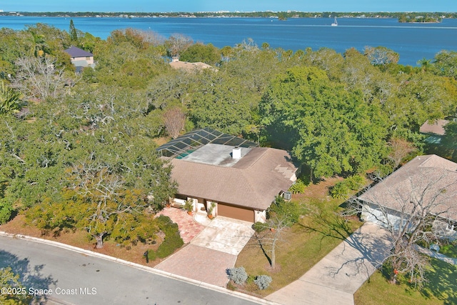 birds eye view of property with a water view