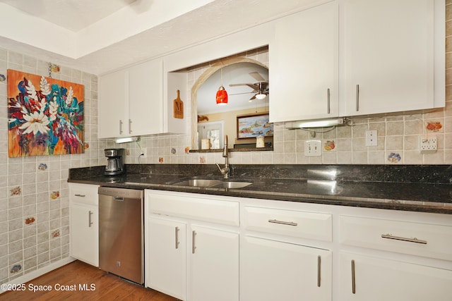 kitchen featuring ceiling fan, stainless steel dishwasher, sink, dark wood-type flooring, and white cabinets