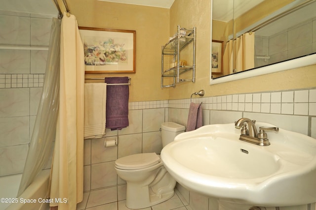 full bathroom with toilet, tile patterned floors, sink, and shower / bath combo with shower curtain