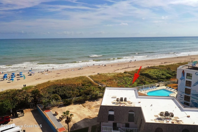 bird's eye view featuring a view of the beach and a water view