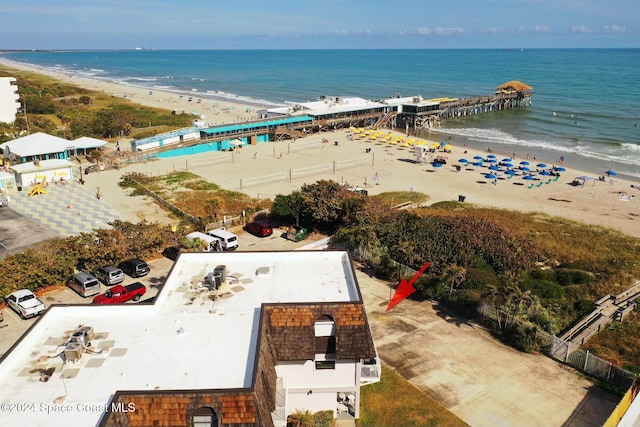 bird's eye view featuring a view of the beach and a water view