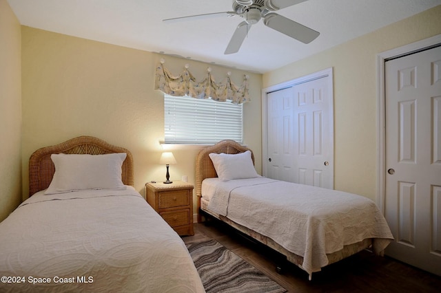 bedroom featuring dark hardwood / wood-style floors and ceiling fan