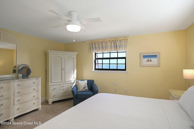 bedroom featuring ceiling fan and wood-type flooring