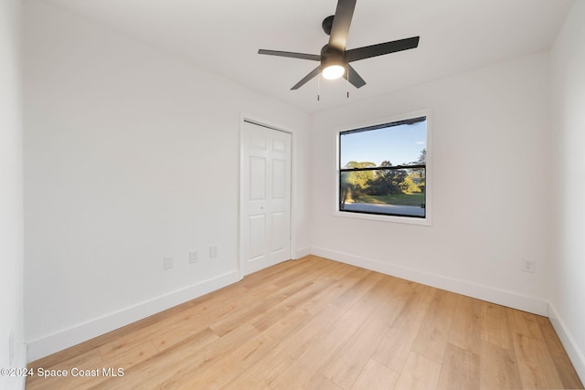 unfurnished room featuring ceiling fan and light wood-type flooring