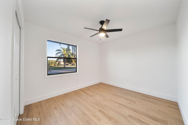 spare room featuring ceiling fan and light hardwood / wood-style floors