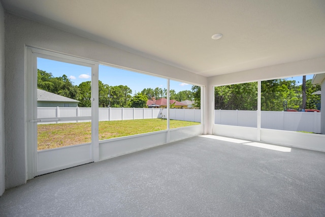 unfurnished sunroom with plenty of natural light