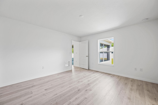 unfurnished room featuring light wood-type flooring