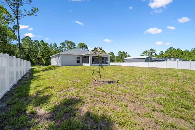 view of yard with a sunroom