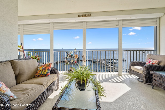 sunroom with a water view