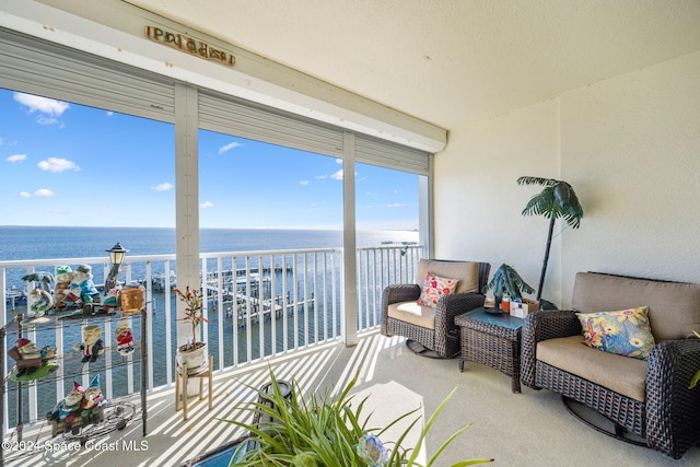 sunroom with a water view