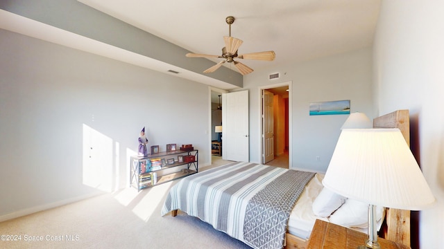 bedroom featuring ceiling fan and light carpet