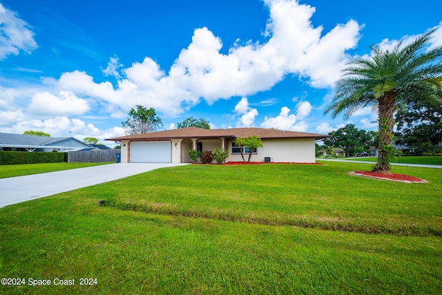 ranch-style home with a front yard and a garage