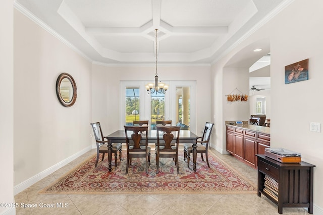 tiled dining area featuring coffered ceiling, ceiling fan with notable chandelier, and ornamental molding