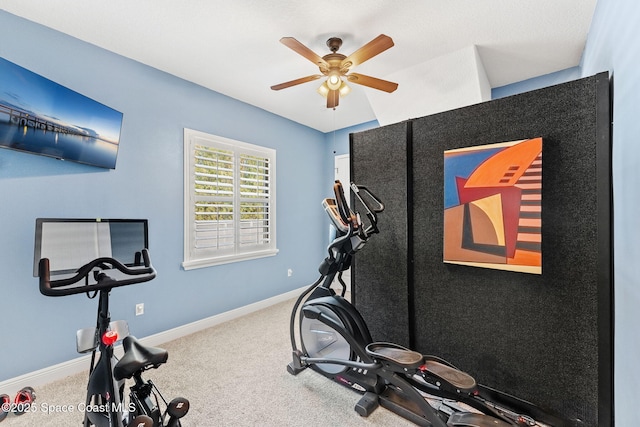 workout area featuring carpet flooring and ceiling fan