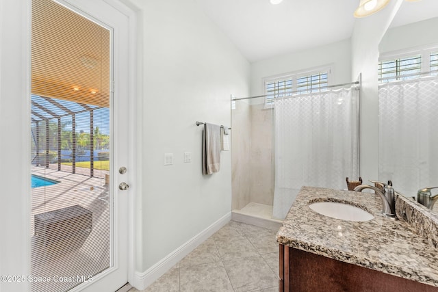 bathroom featuring lofted ceiling, vanity, tile patterned flooring, and a shower with shower curtain