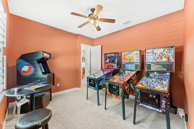 recreation room with carpet floors and ceiling fan