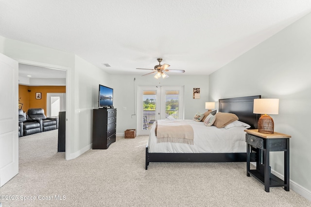 carpeted bedroom with access to outside, ceiling fan, and french doors