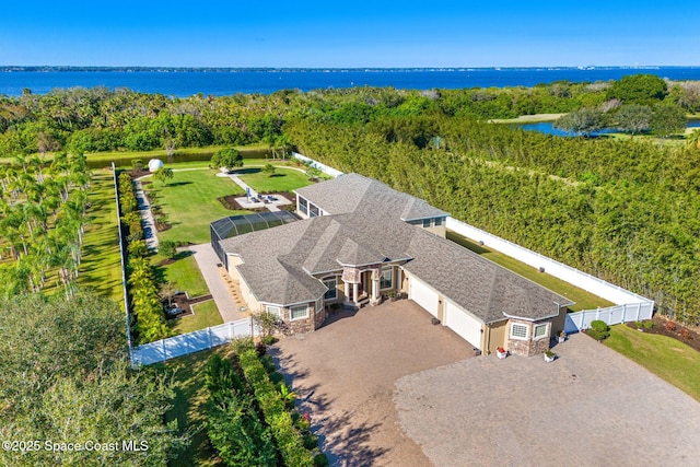 birds eye view of property with a water view