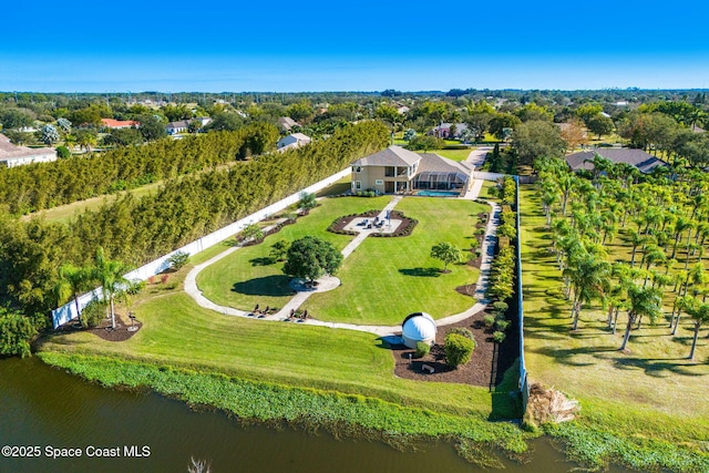 birds eye view of property with a water view