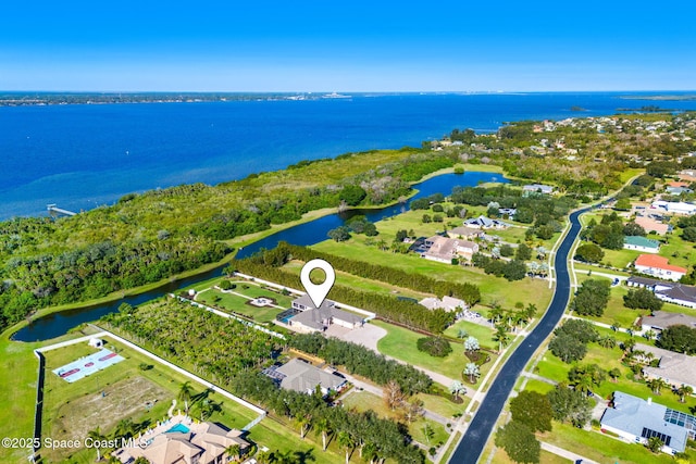 birds eye view of property featuring a water view