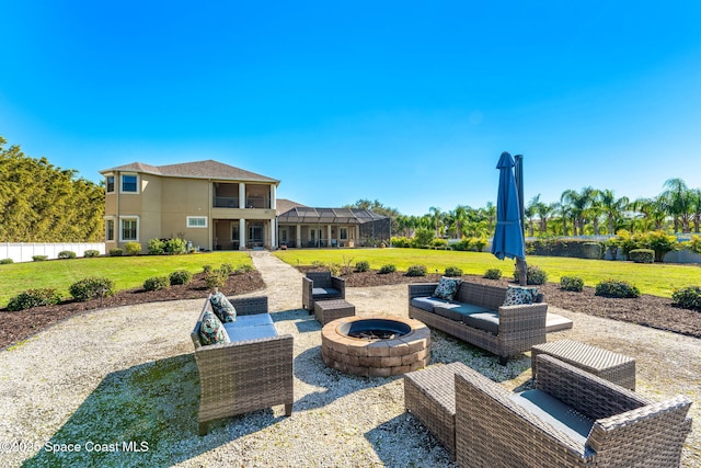 view of patio with a lanai and an outdoor fire pit