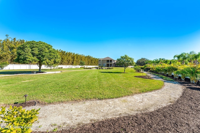 view of property's community with a lawn