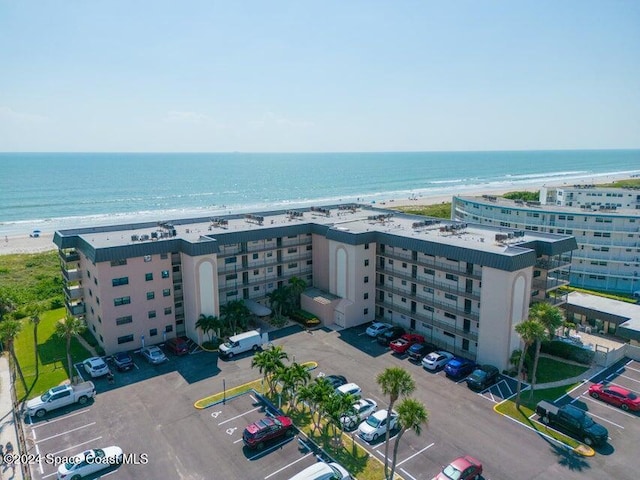 bird's eye view with a view of the beach and a water view