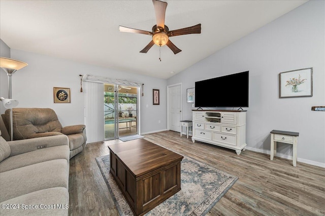 living room featuring ceiling fan, lofted ceiling, and dark hardwood / wood-style flooring