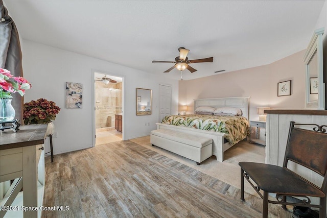 bedroom with ceiling fan, ensuite bath, and light hardwood / wood-style flooring