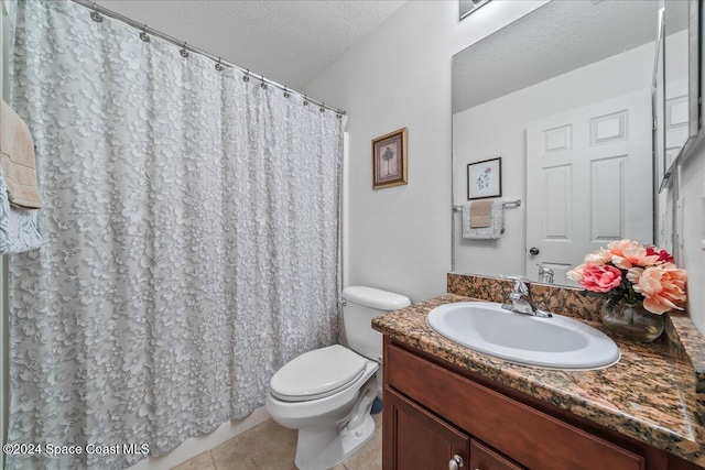 bathroom with curtained shower, tile patterned flooring, vanity, toilet, and a textured ceiling