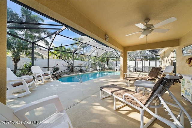 view of pool featuring a lanai and a patio